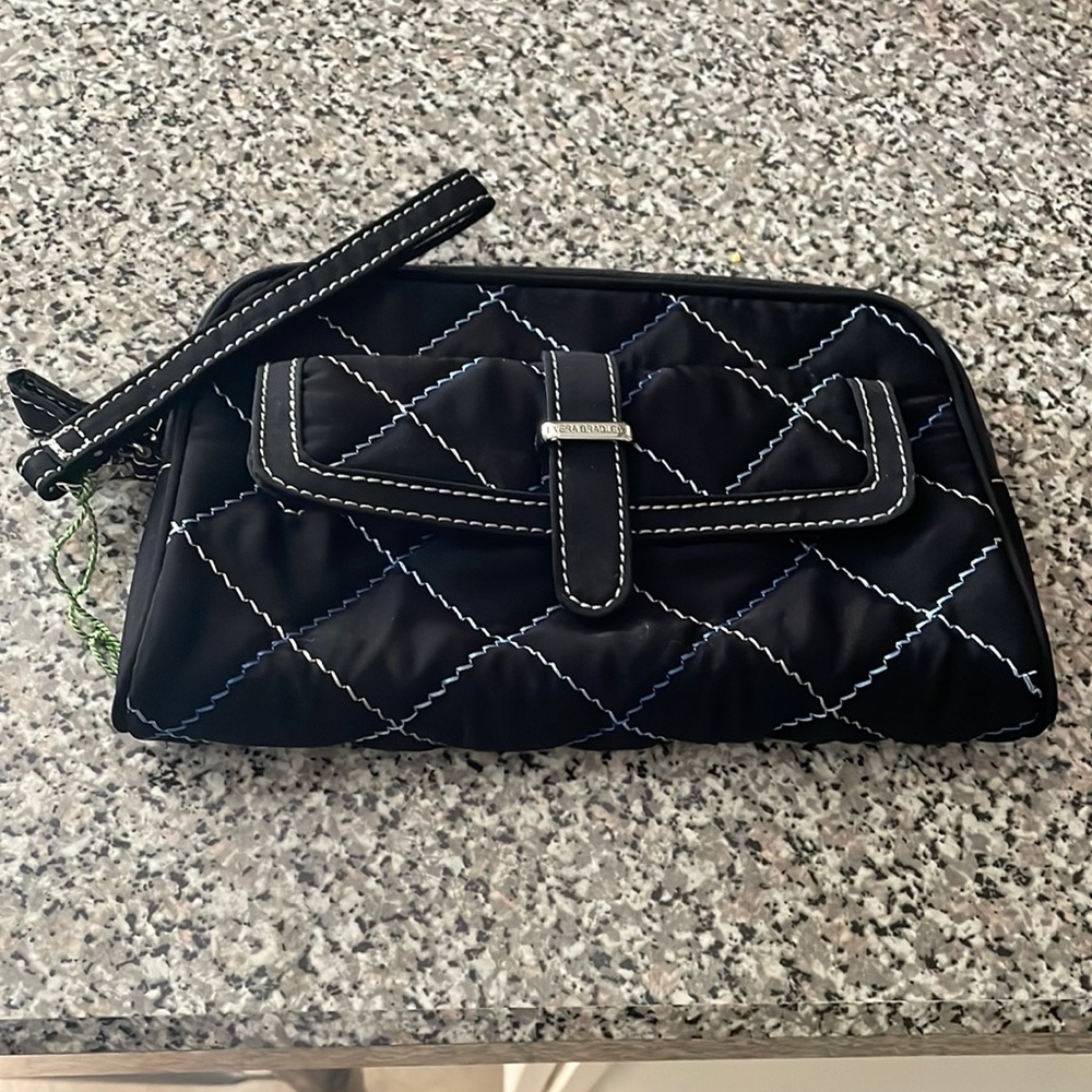 Brand New with tags Vera Bradley Berkeley Clutch Black. 1 inside zip pocket